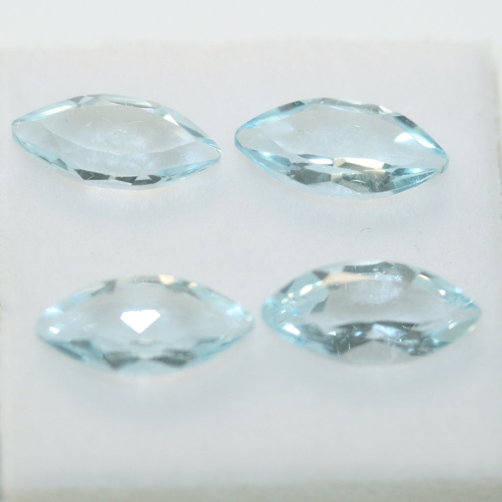 Lot de topazes bleu ciel facettées en forme de marquise 10x5mm.-(4 pièces).