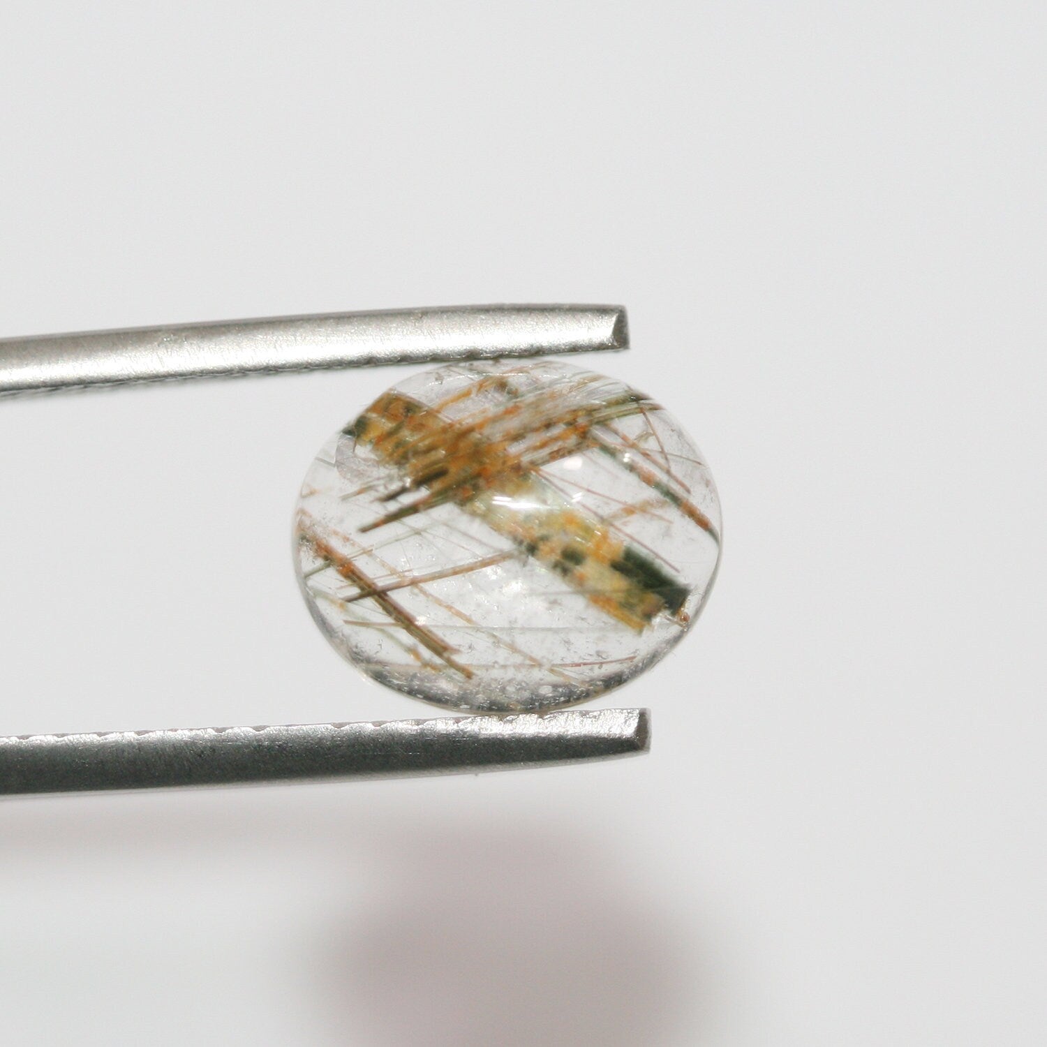 Lote de 6 cabujones ovalados de cuarzo rutilado de 11 x 9 mm. (6 uds.)