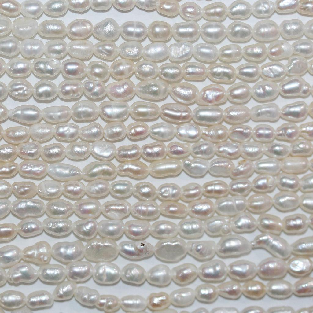 Perla de agua dulce ovalada de 35 cm, 3-4 mm, tira de 35 cm. Precios al por mayor.