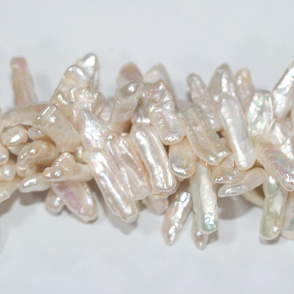 Perlas Biwas blancas de agua dulce de 17", 20 x 6 mm (aprox.), tira de 41 cm. Precios al por mayor.