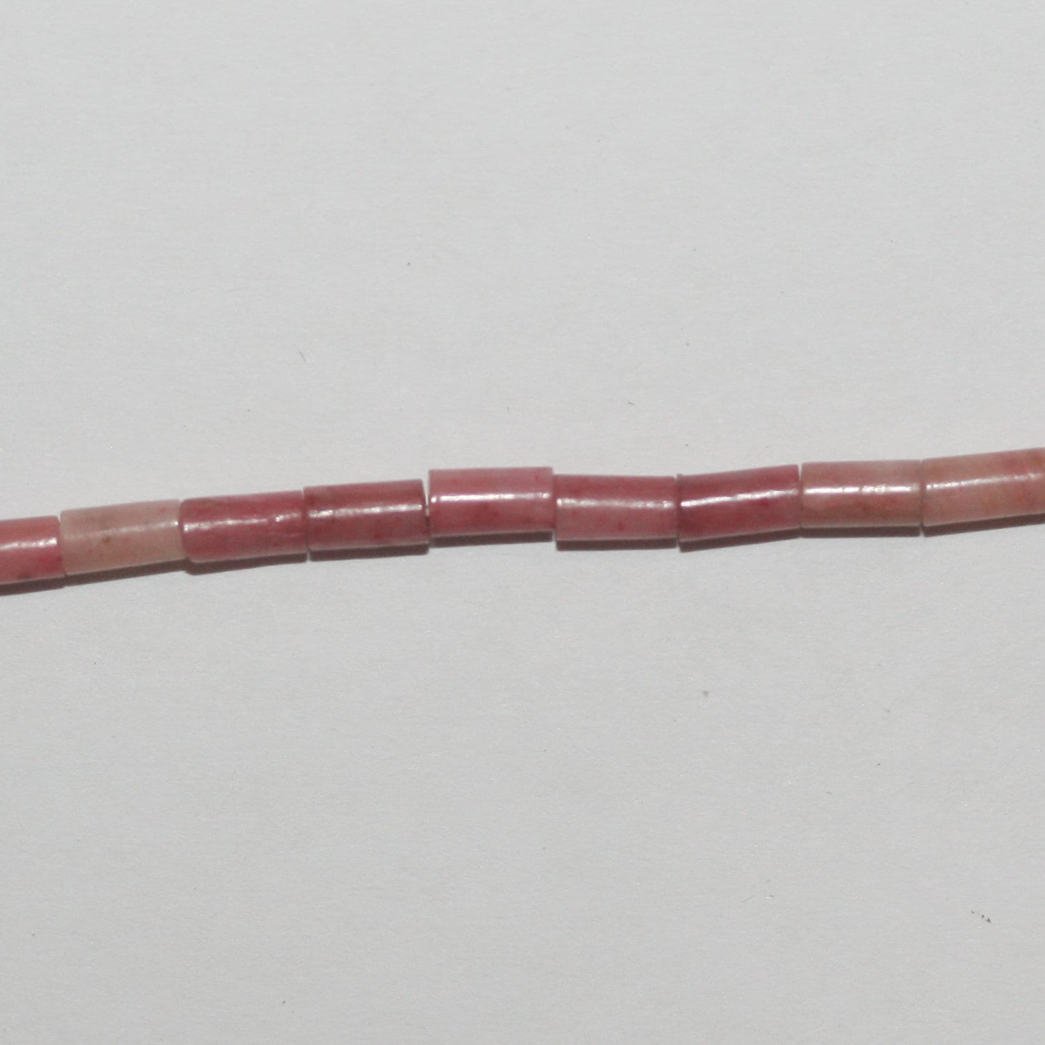 Perles tubulaires lisses en rhodonite St 15" 4x2mm.- Brin 39cm.