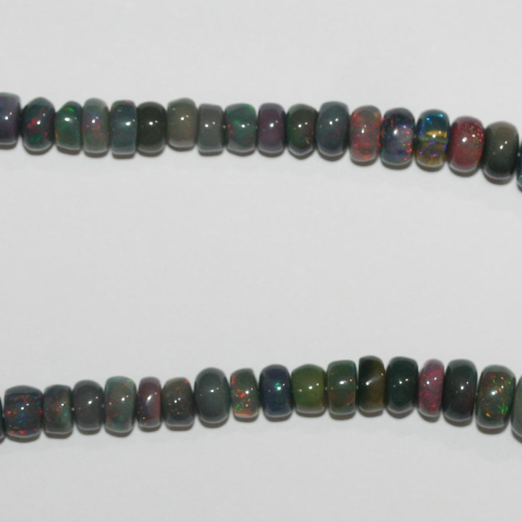 Perles rondelles lisses dégradées en opale noire d'Éthiopie, 40 cm (16 pouces), 3 x 2 à 5 x 3 mm. Fil de 40 cm (16 pouces).