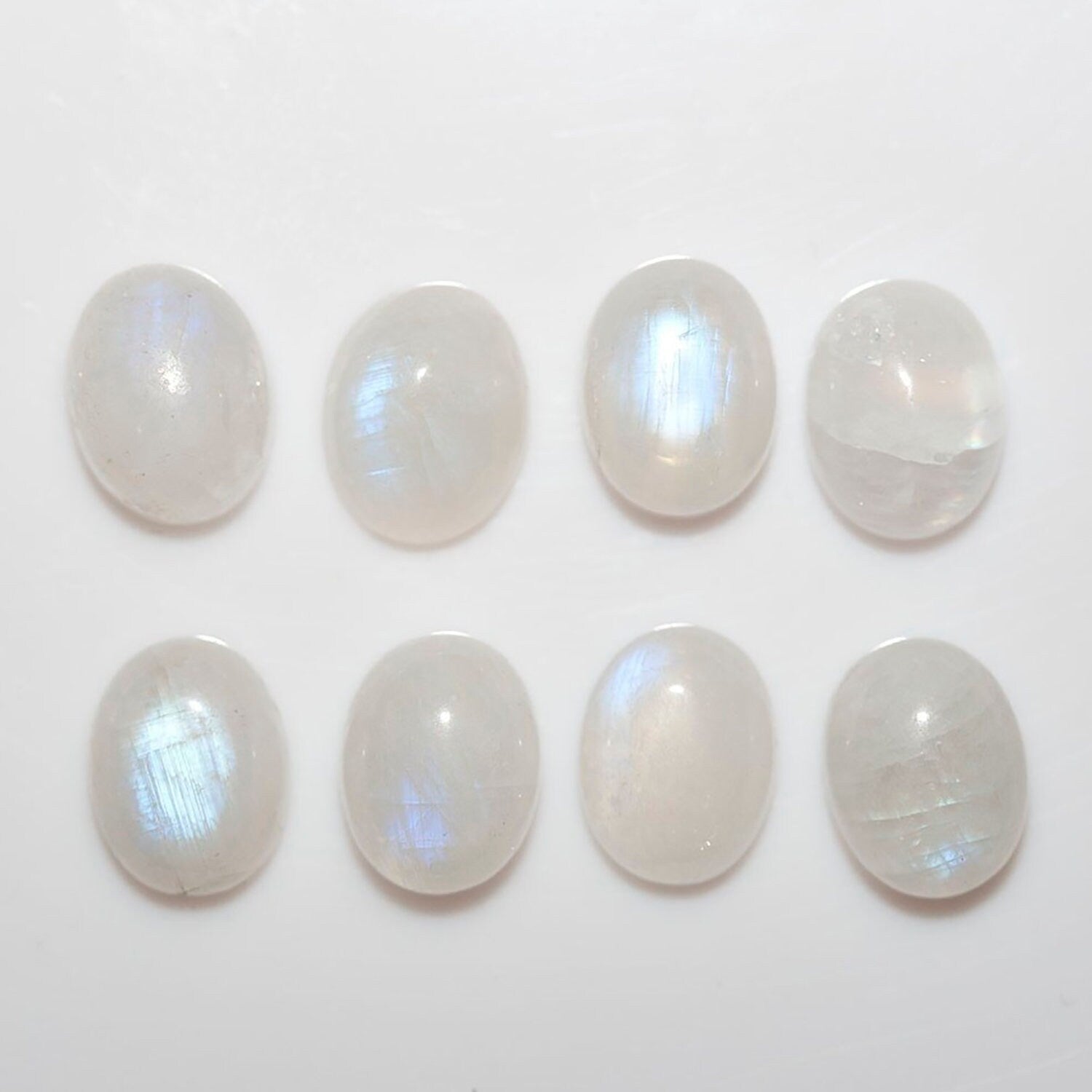 Lote de 8 cabujones ovalados de piedra lunar de 9 x 7 mm. (8 uds.)
