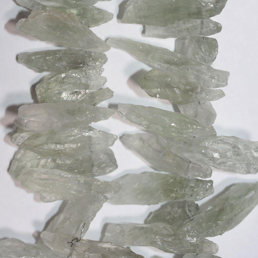 Perlas de cuarzo cristal de roca verde St. de 16" sin pulir, 35 x 10 mm, aprox. - Hilo de 40 cm.