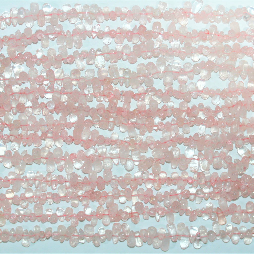 Perles en quartz rose lisses en forme de goutte, 10 x 5 mm environ - Longueur du fil : 36 cm.