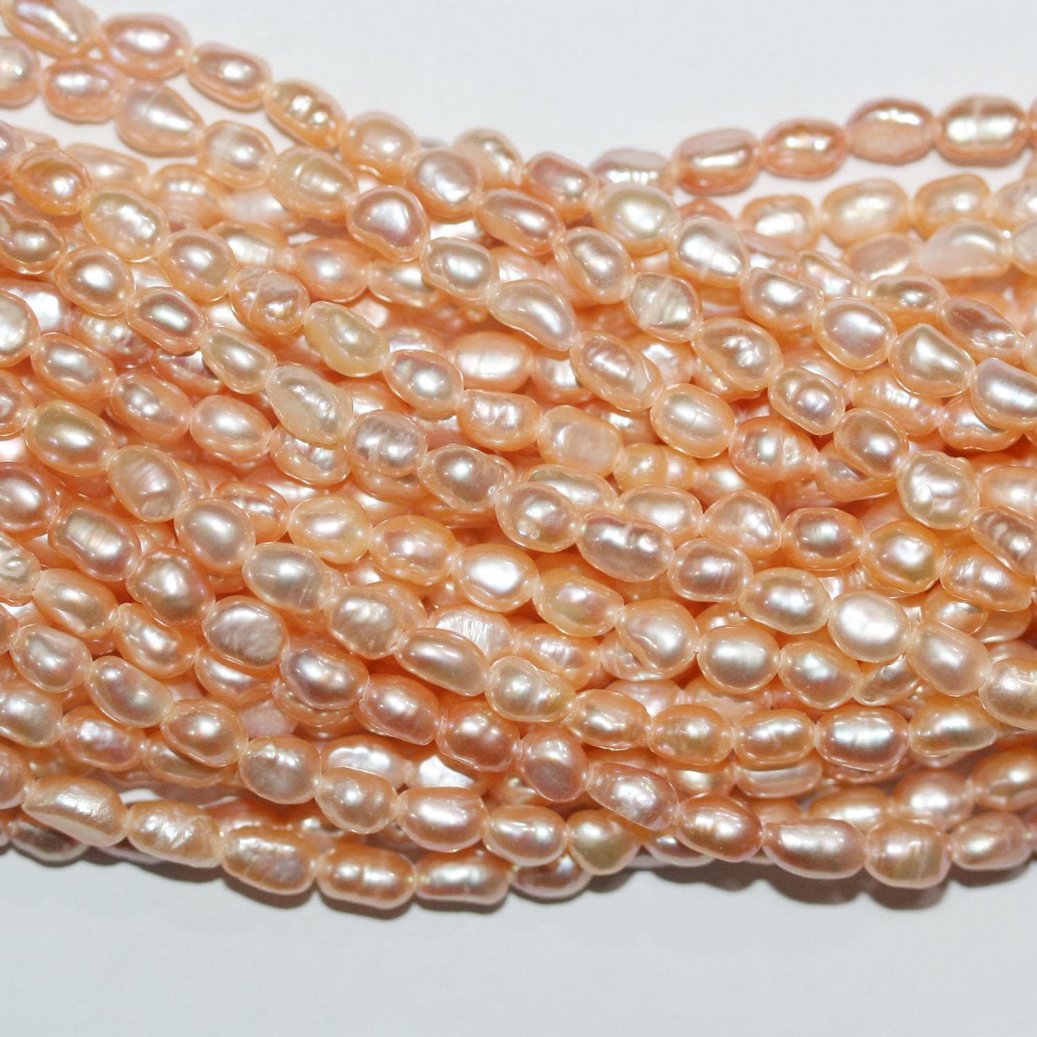 13" St FreshWater Salmon Oval Pearl 4-4.5mm.-Strand 35cm. -Natural Pearls wholesale Prices