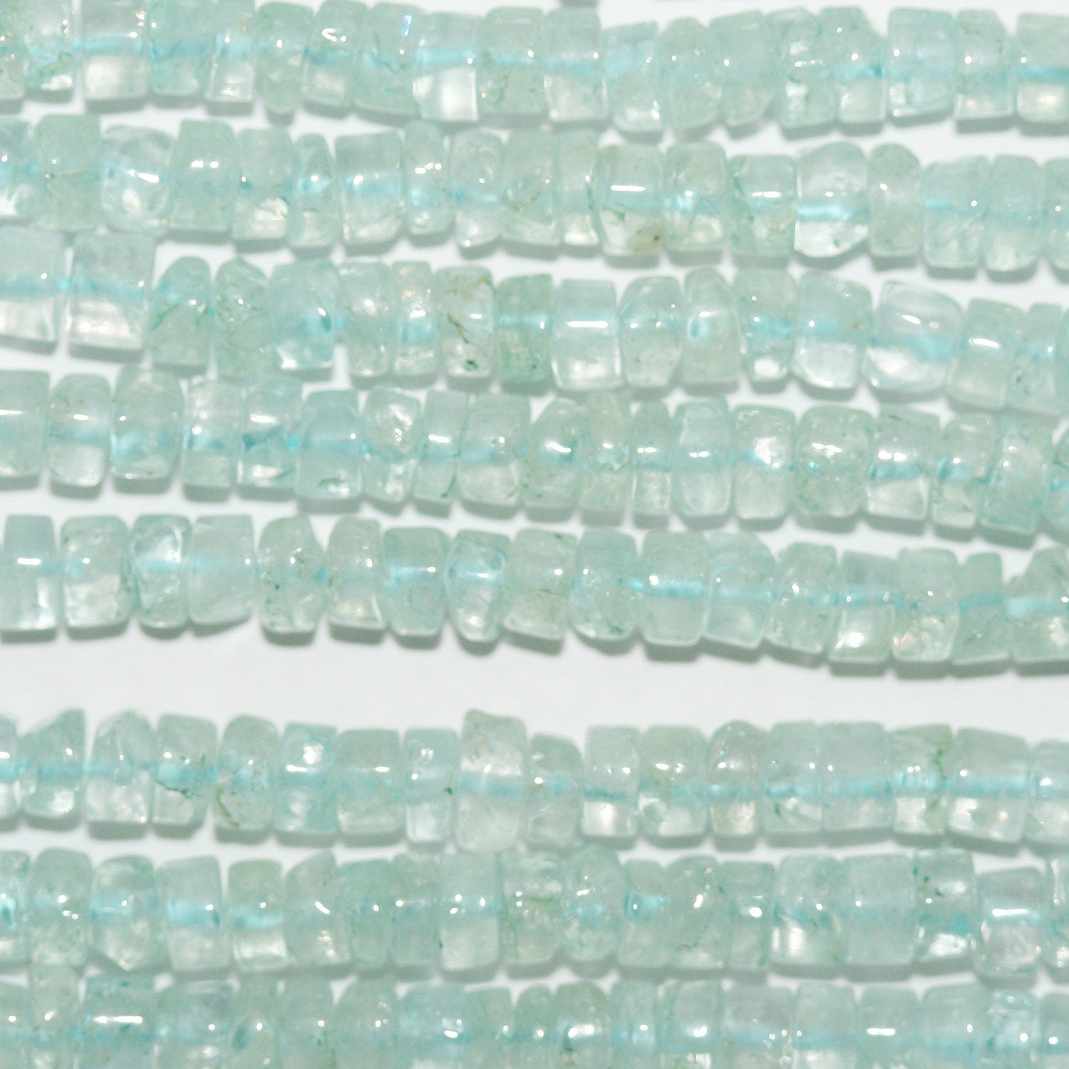 13" St Aquamarine Smooth Rondelle Beads 4x2mm.-Strand 33cm.