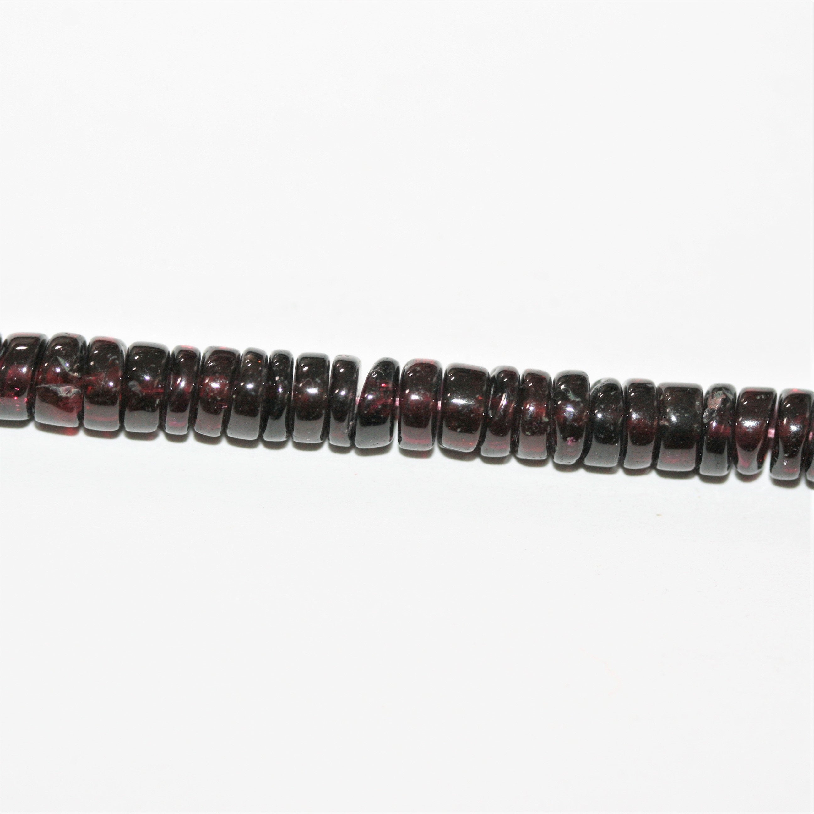 13" St Garnet Smooth Disc Beads 5x2mm.- Strand 33cm.