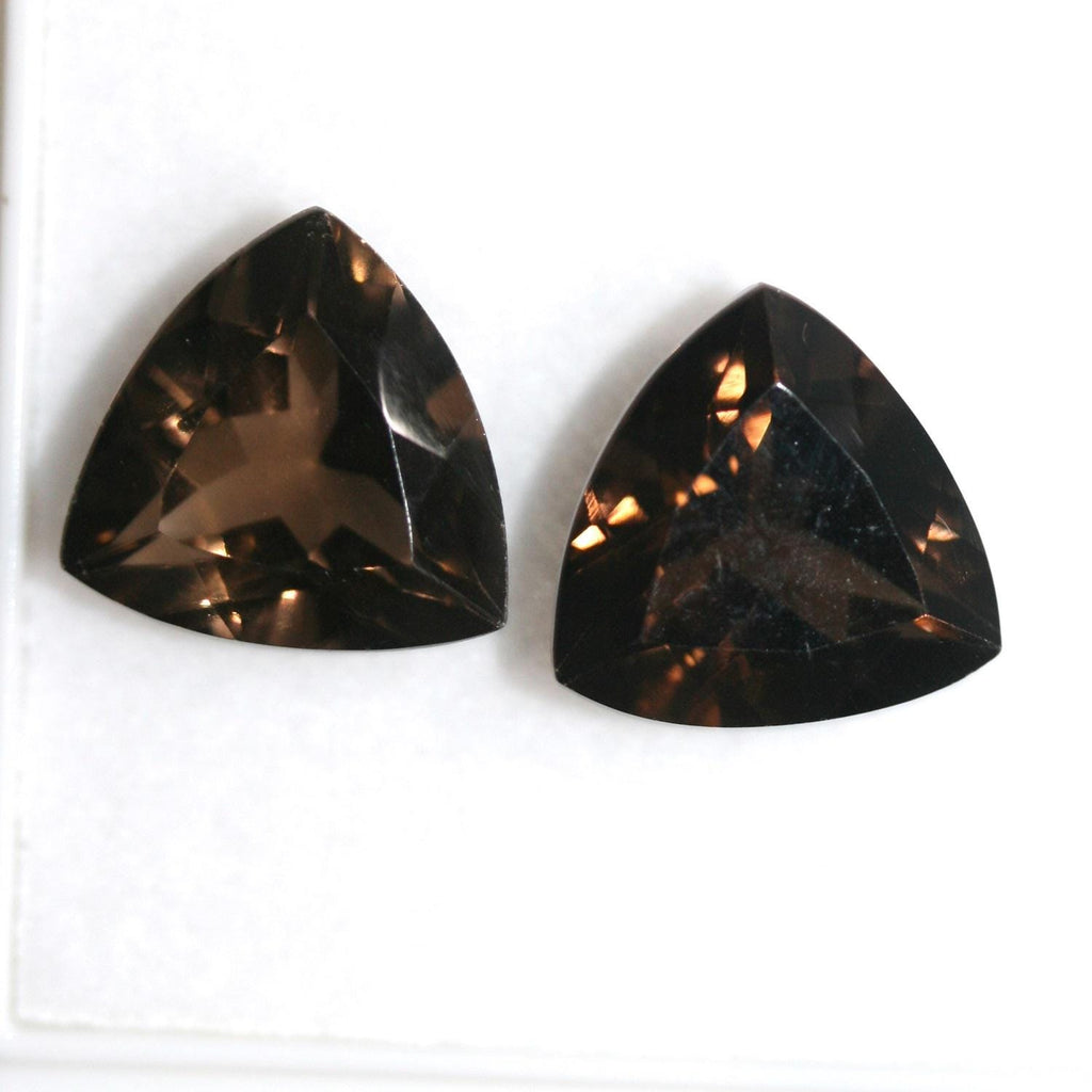 Lote de 2 trillones de cuarzo ahumado facetado de 14 mm.