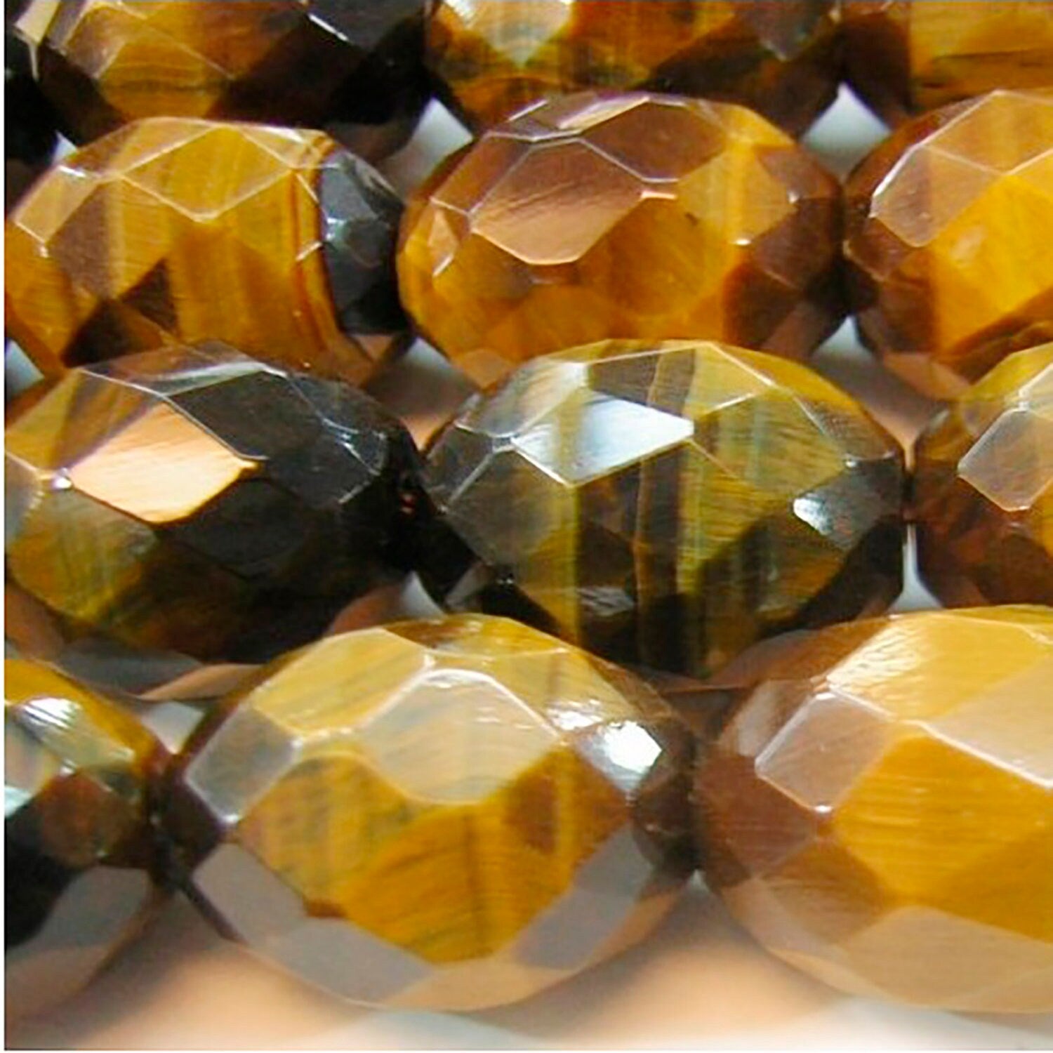 Cuentas de barril facetadas de ojo de tigre de 16" de St. 20 x 14 mm - Hilo de 40 cm.