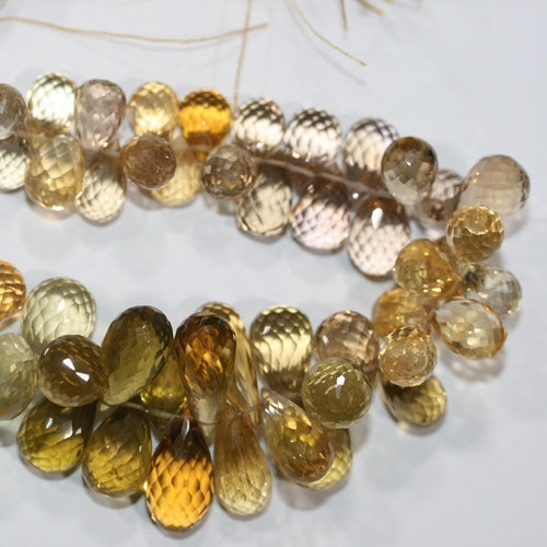 Perles en quartz citron St - citrine facettées en forme de goutte, dégradées. 15 x 8 mm - 10 x 7 mm. - Fil de 22 cm.