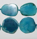 Perles ovales plates et lisses en agate bleue St, 40 cm environ (32-54 mm). Longueur du fil : environ 40 cm.