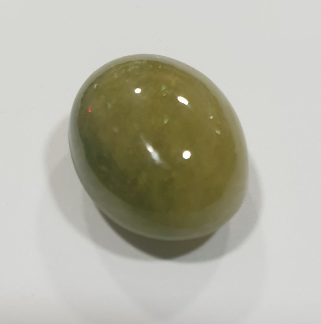 Green Sapphire Oval Cabochon 15x12mm.(15.9ct.).