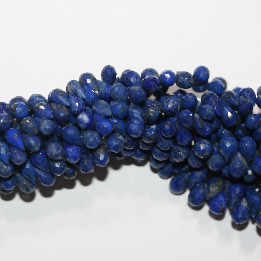 Perles en lapis-lazuli facettées de 8 pouces (6 x 4 mm). Longueur du fil : environ 20 cm.