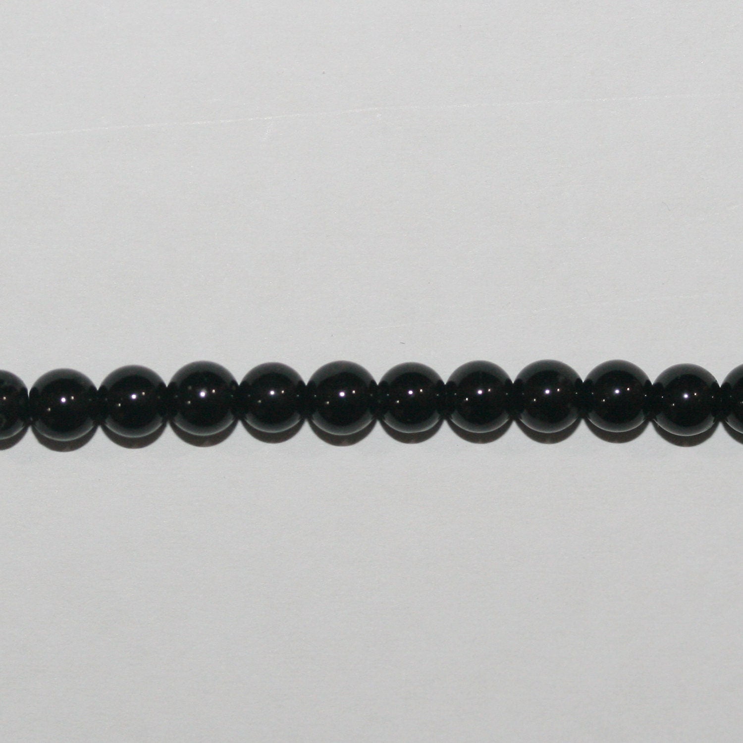 Cuentas redondas de turmalina negra de 4 mm (16") - Hilo de 40 cm