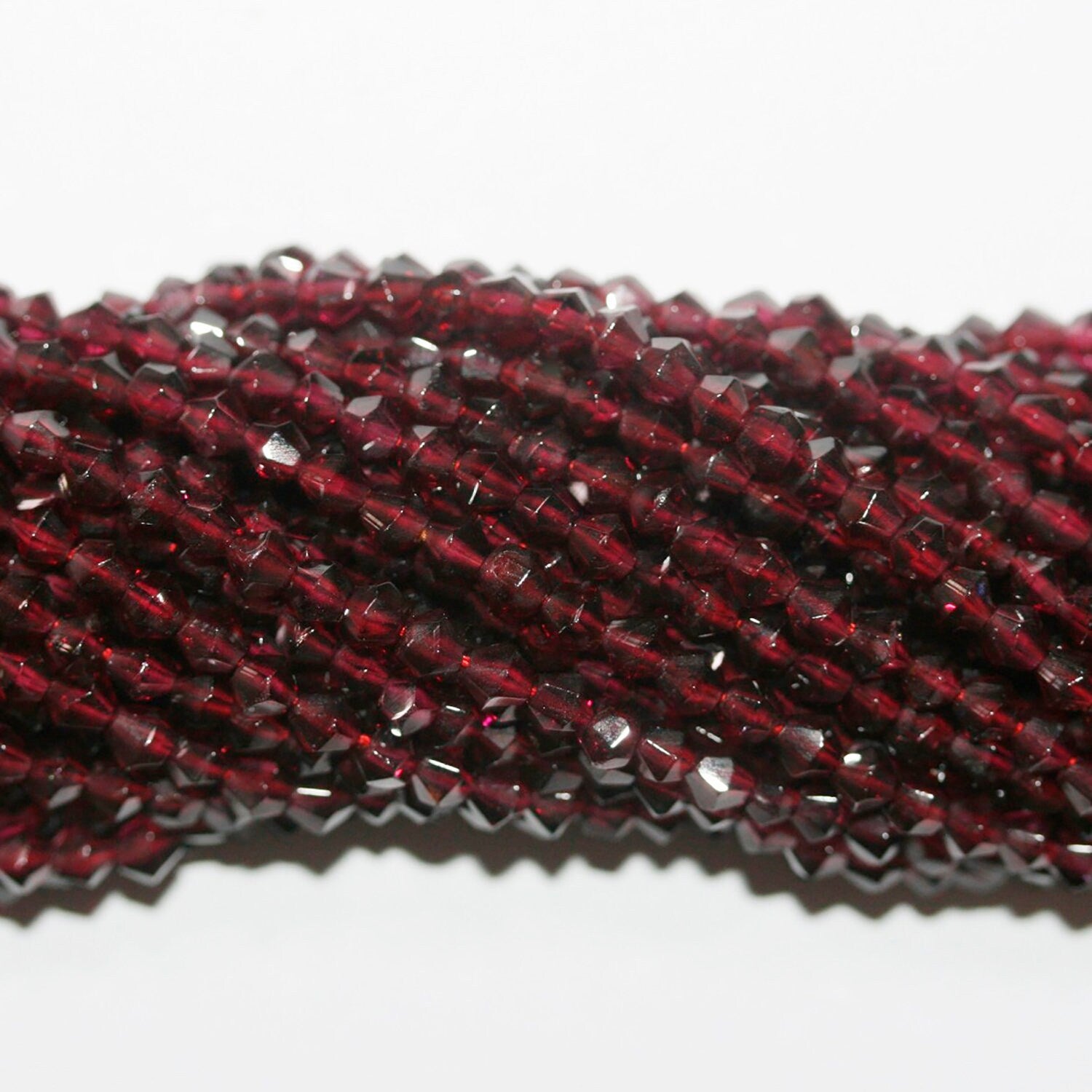 13" St Garnet Faceted Bicone Beads 4mm.-Strand 37cm