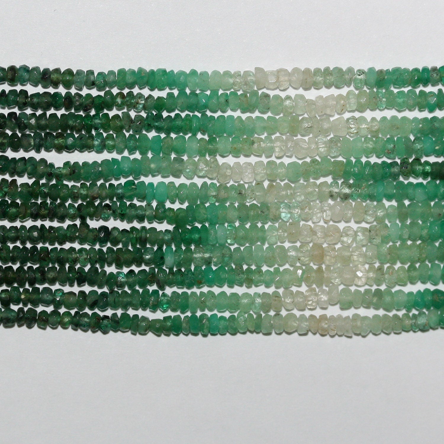 Perles rondelles à facettes St Emerald 15" 2,5 x 1,5 mm - Fil de 40 cm.