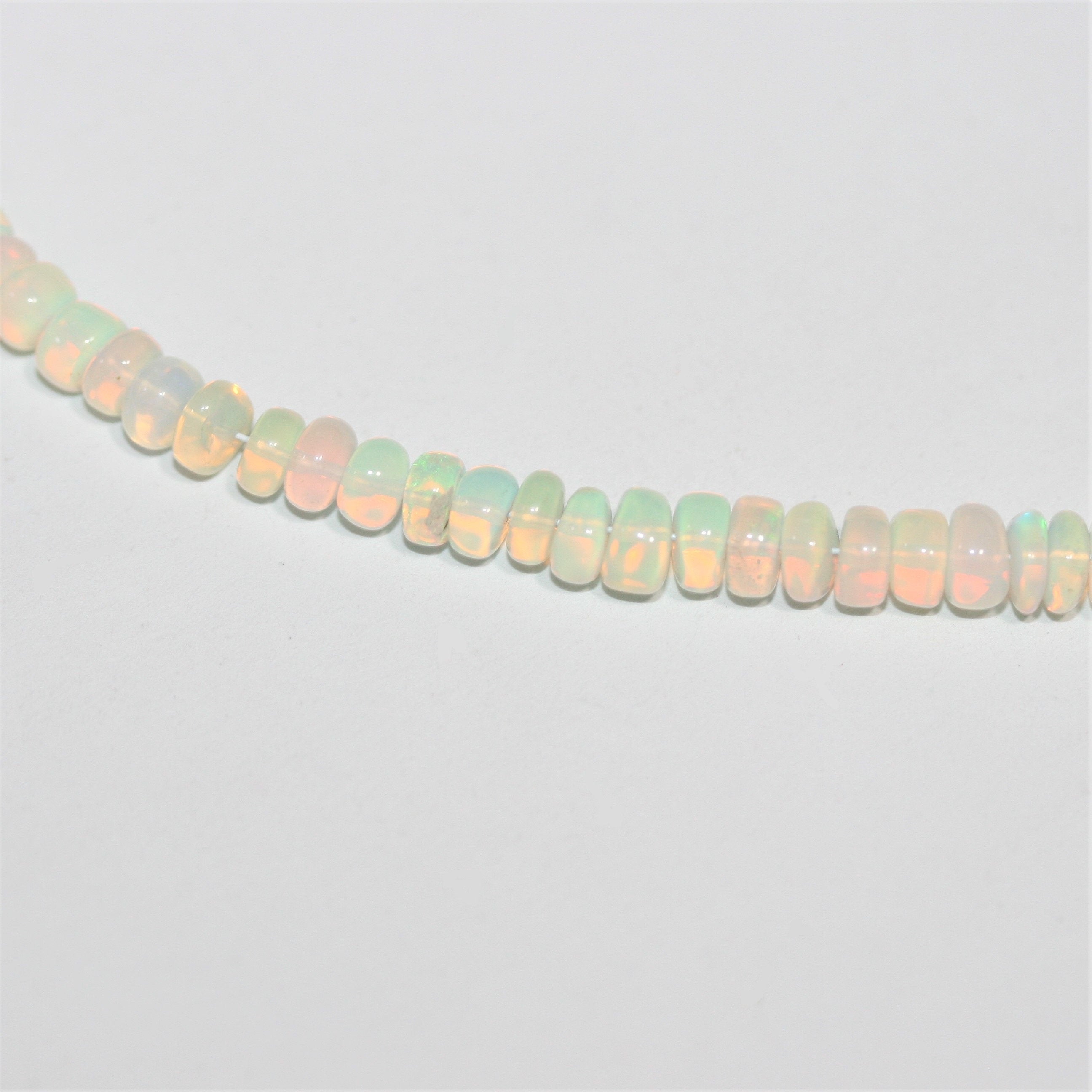 Cuentas redondas lisas graduadas de ópalo etíope de 16", 4 x 2 - 5,5 x 3 mm, tira de 40 cm.