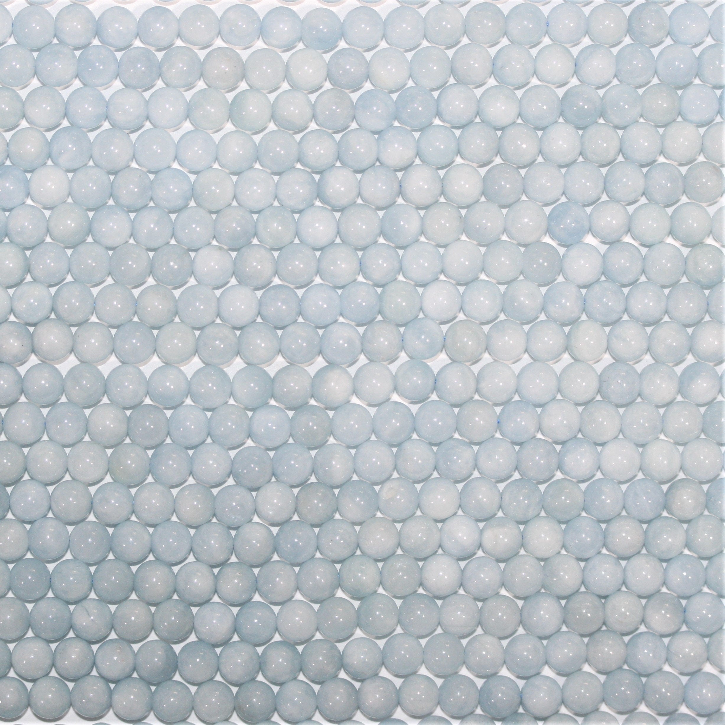 Perles rondes lisses en aigue-marine 6-6,5 mm - Fil de 40 cm.