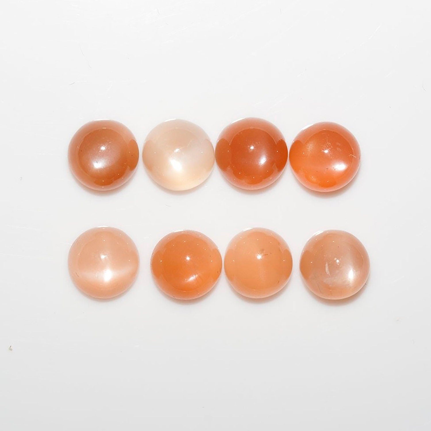 Lote de 8 cabujones redondos de piedra lunar melocotón de 7 mm. (8 uds.)