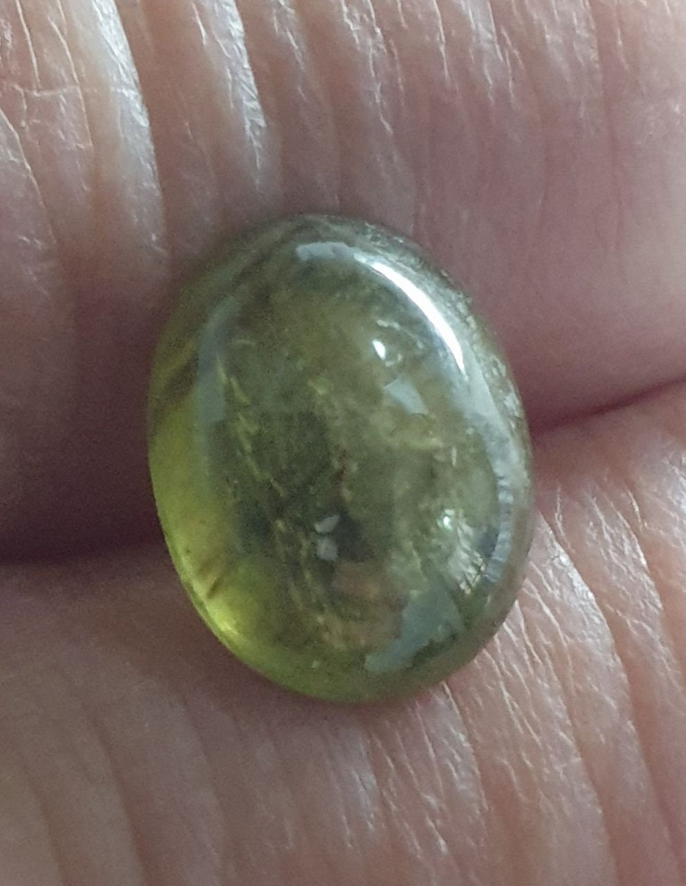 Green Sapphire Oval Cabochon 11.7x9mm.(5.7ct.).