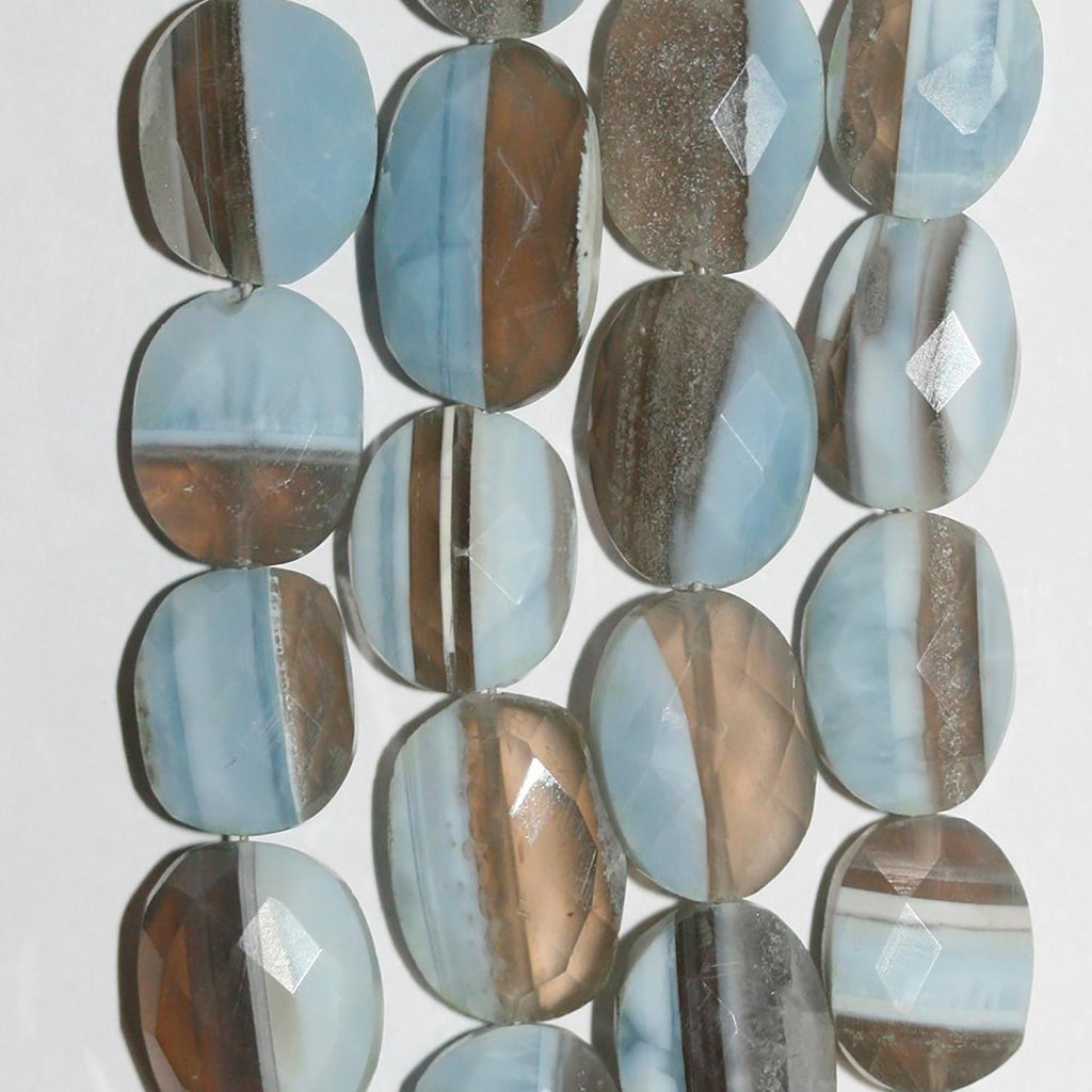 Cuentas ovaladas facetadas de ópalo azul de 8" (13 x 10 mm). Hilo aproximado de 20 cm.