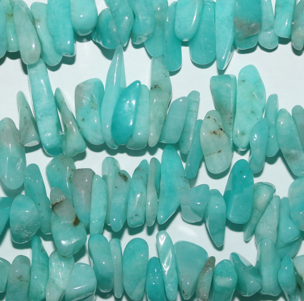 Cuentas lisas de amazonita de 16" (12 x 4 mm). Hilo de 40 cm aprox.