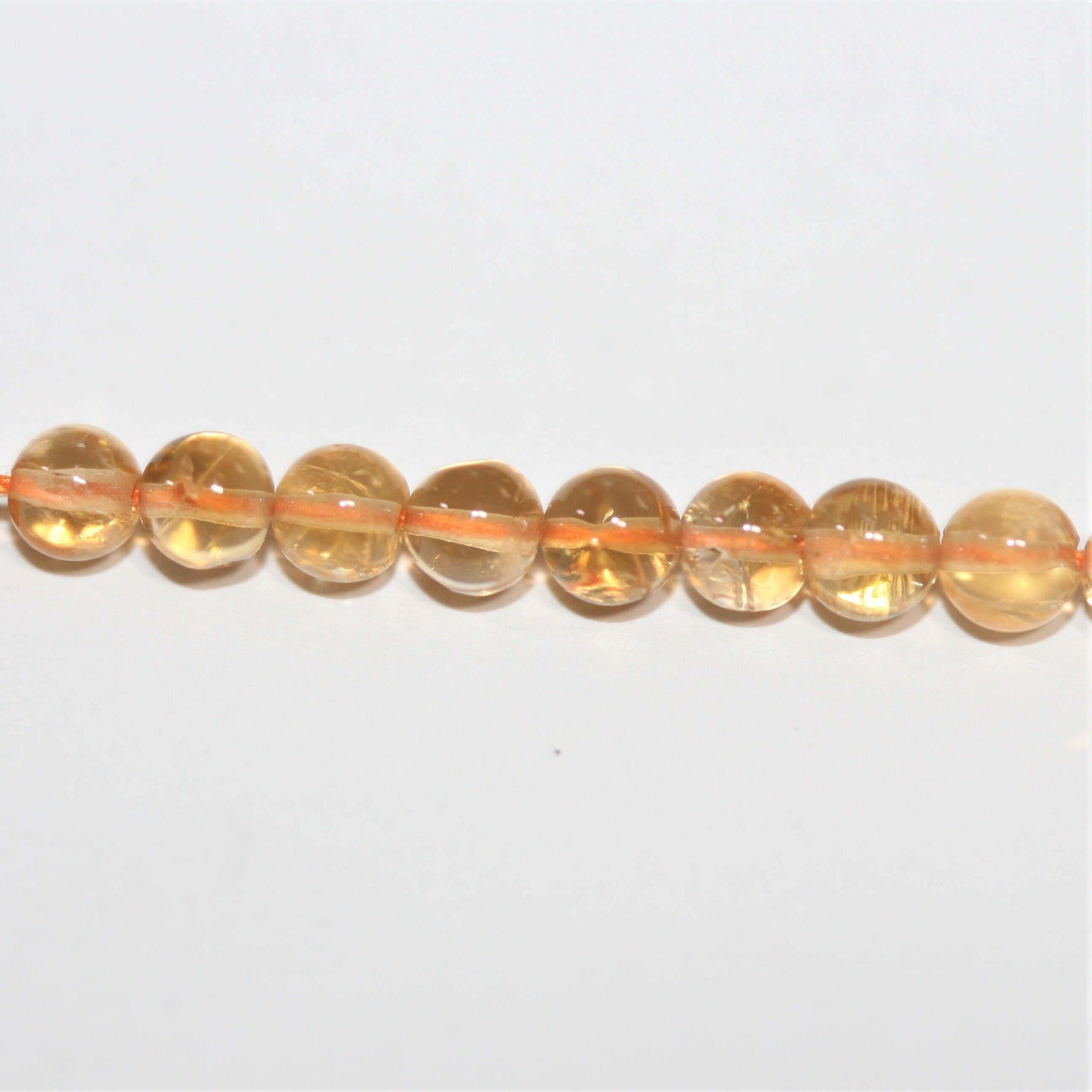 Perles rondes lisses de citrine 4 mm - Fil de 38 cm.