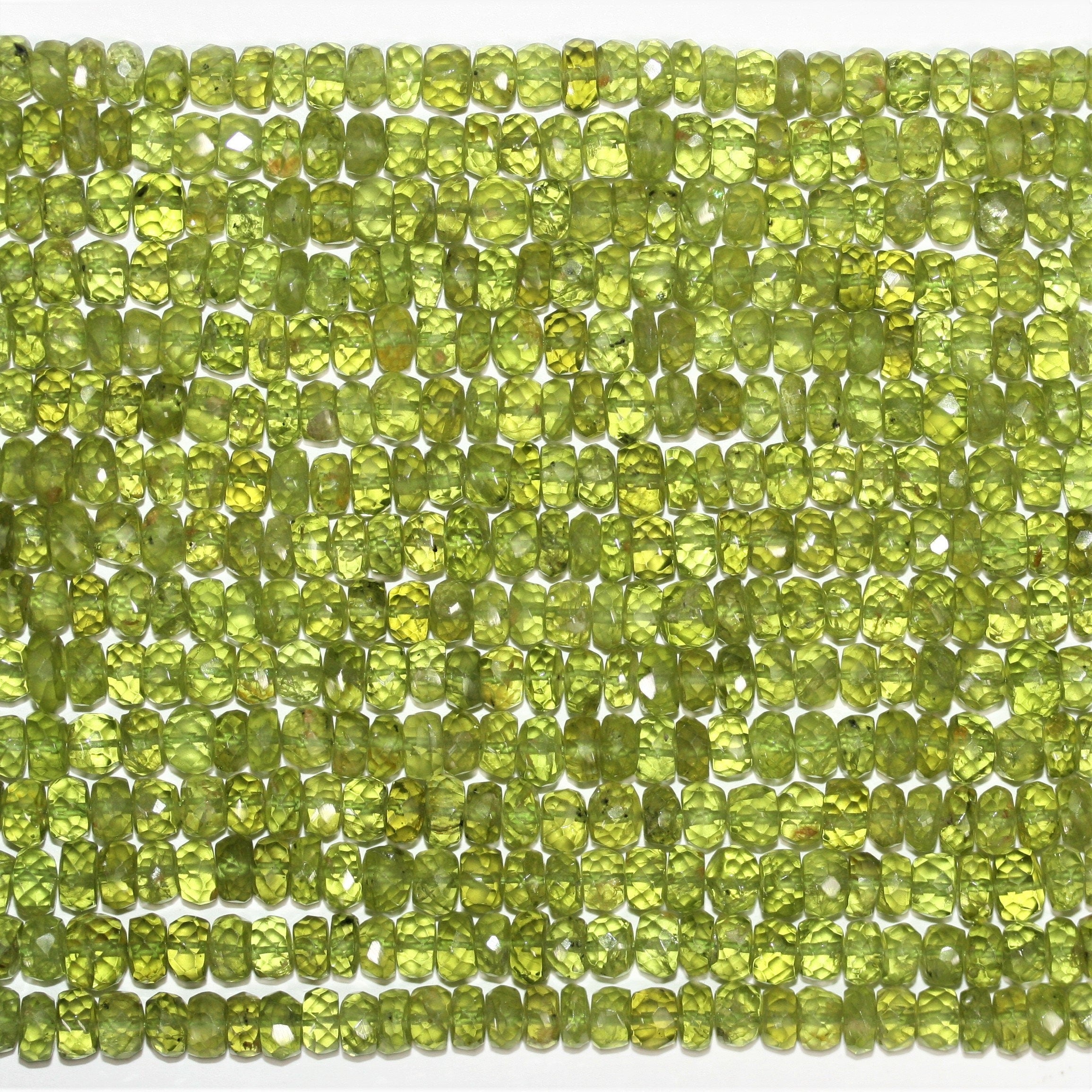 13" St Peridot Faceted Rondelle Beads 6x3.5mm.-Strand 33cm.