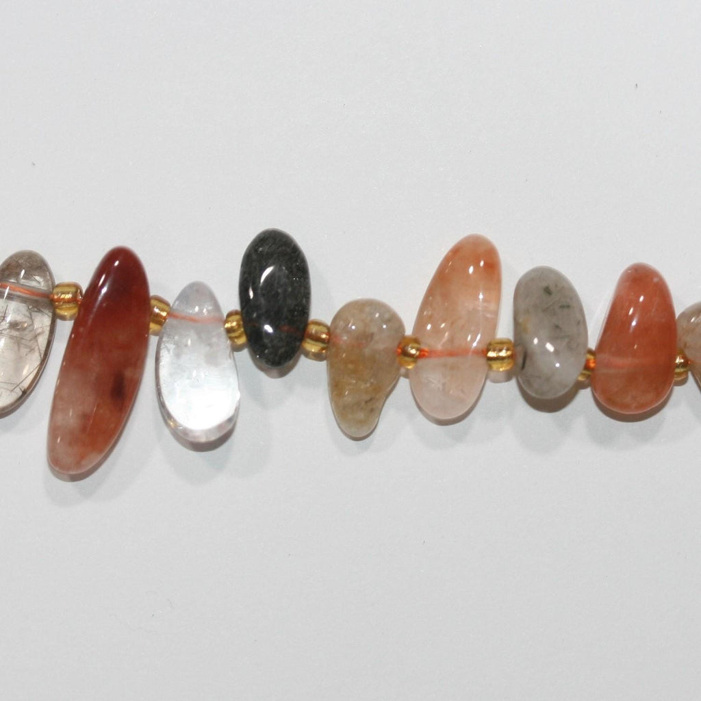 Perles de quartz rutile St à pointes lisses, 14 x 7 mm environ. Longueur du fil : 39 cm environ. Réf. 14741