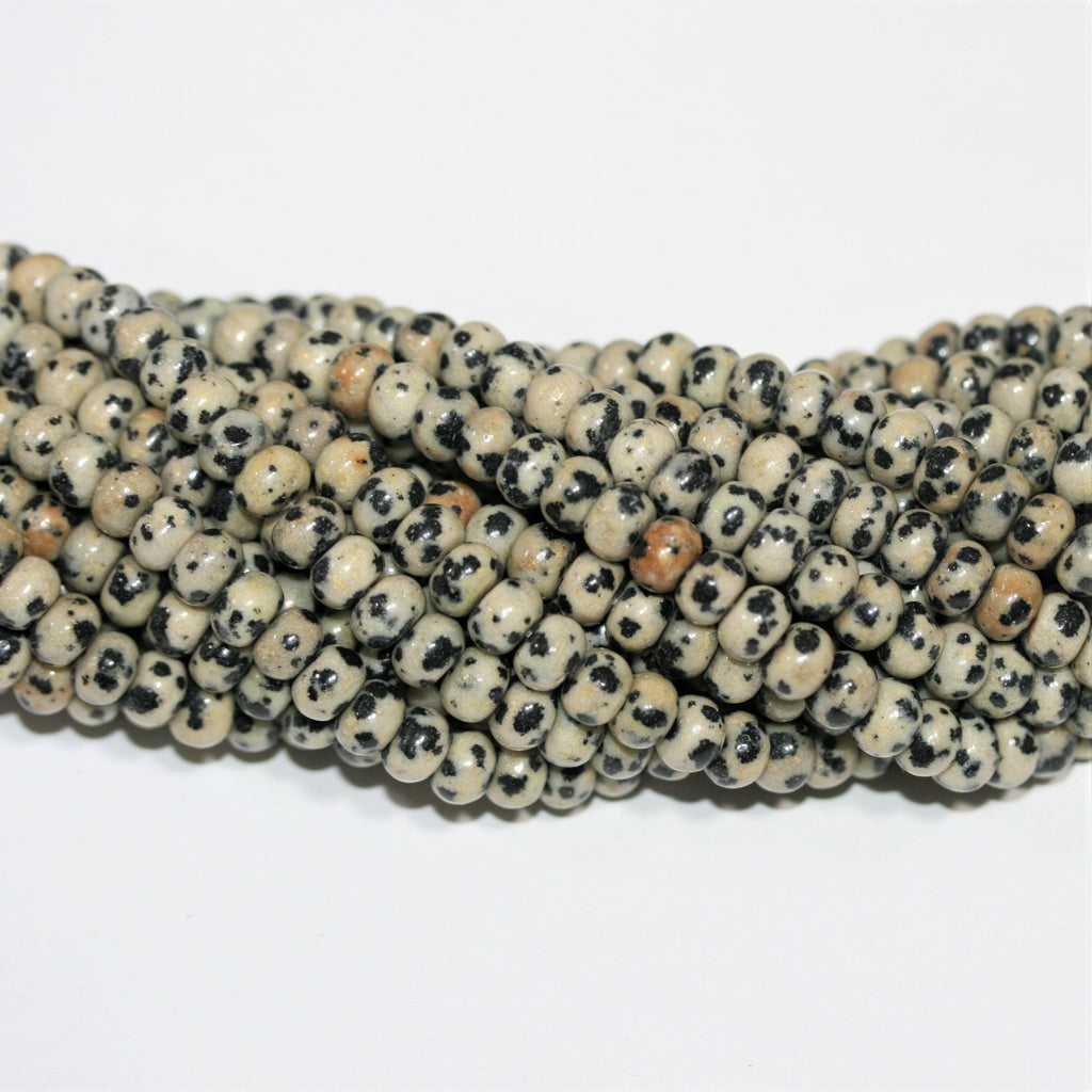 Perles rondelles lisses en jaspe Saint-Dalmatien 15" 6x4mm.- Brin 39cm.