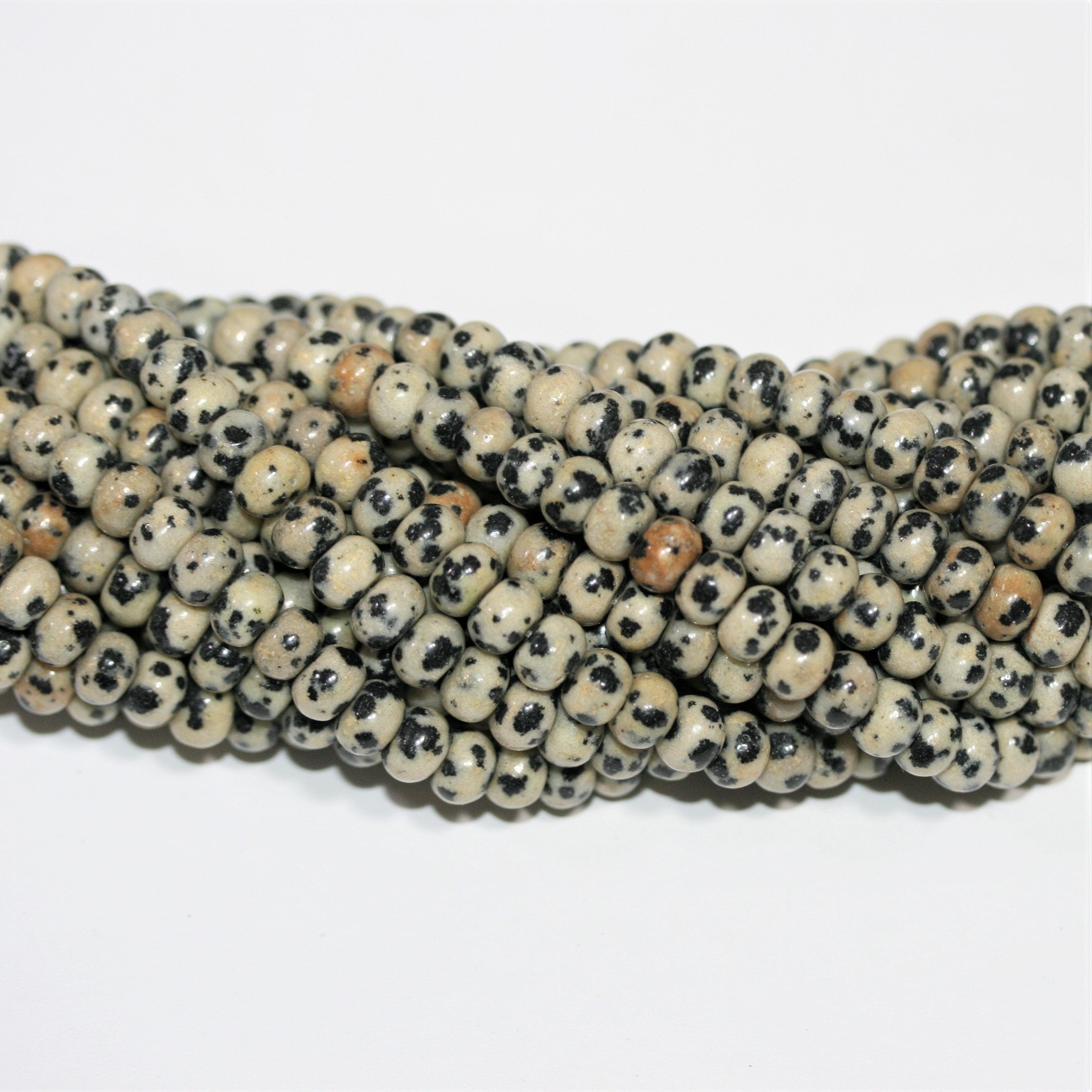 Perles rondelles lisses en jaspe Saint-Dalmatien 15" 6x4mm.- Brin 39cm.