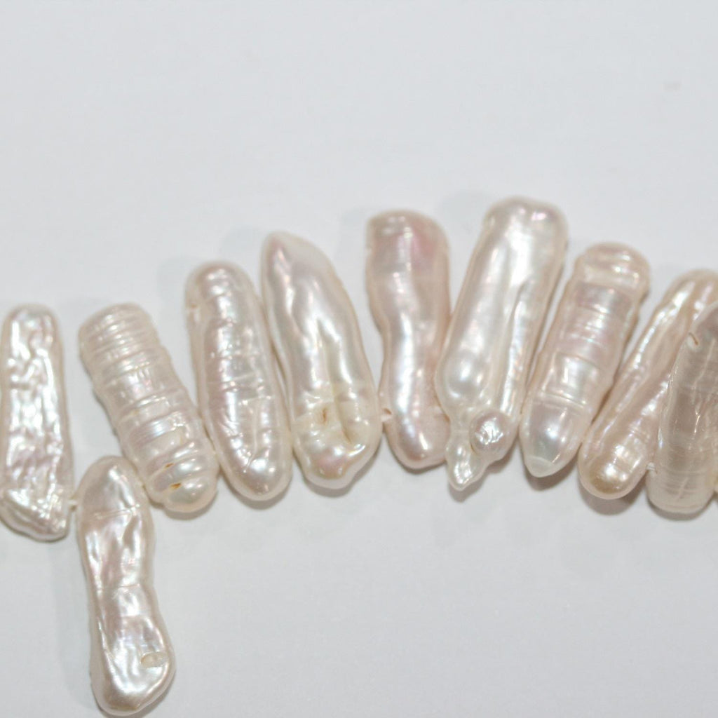 Perlas Biwas blancas de agua dulce de 17", 20 x 6 mm (aprox.), tira de 41 cm. Precios al por mayor.