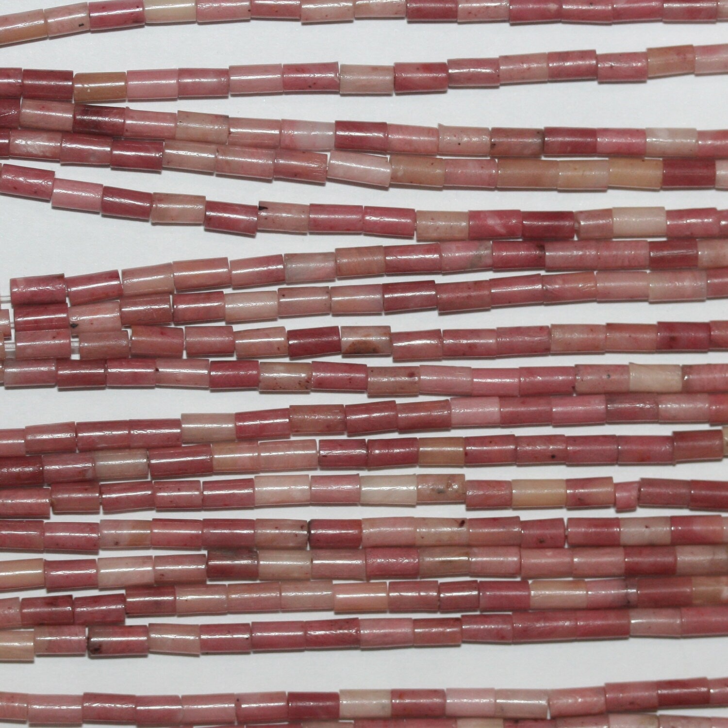 Perles tubulaires lisses en rhodonite St 15" 4x2mm.- Brin 39cm.