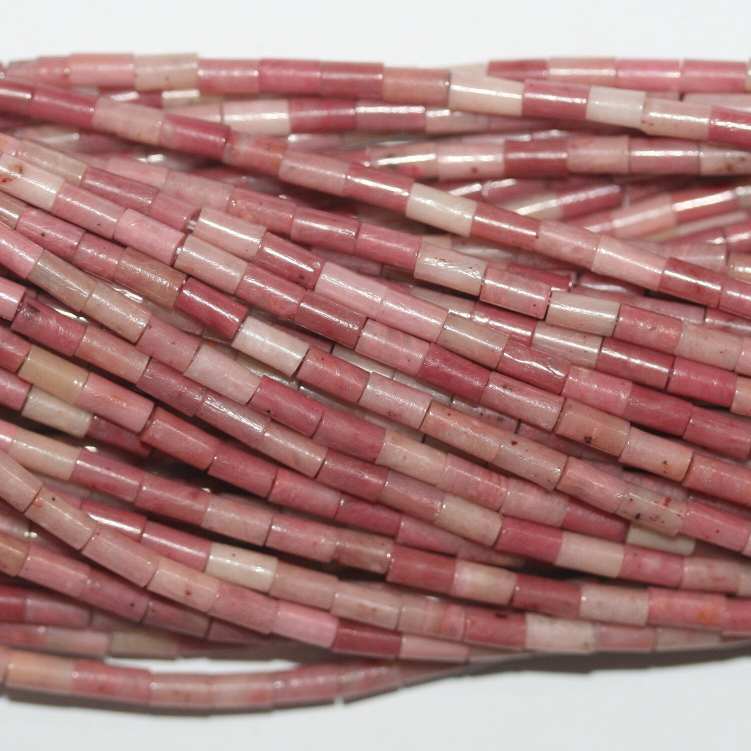 Perles tubulaires lisses en rhodonite St 15" 4x2mm.- Brin 39cm.