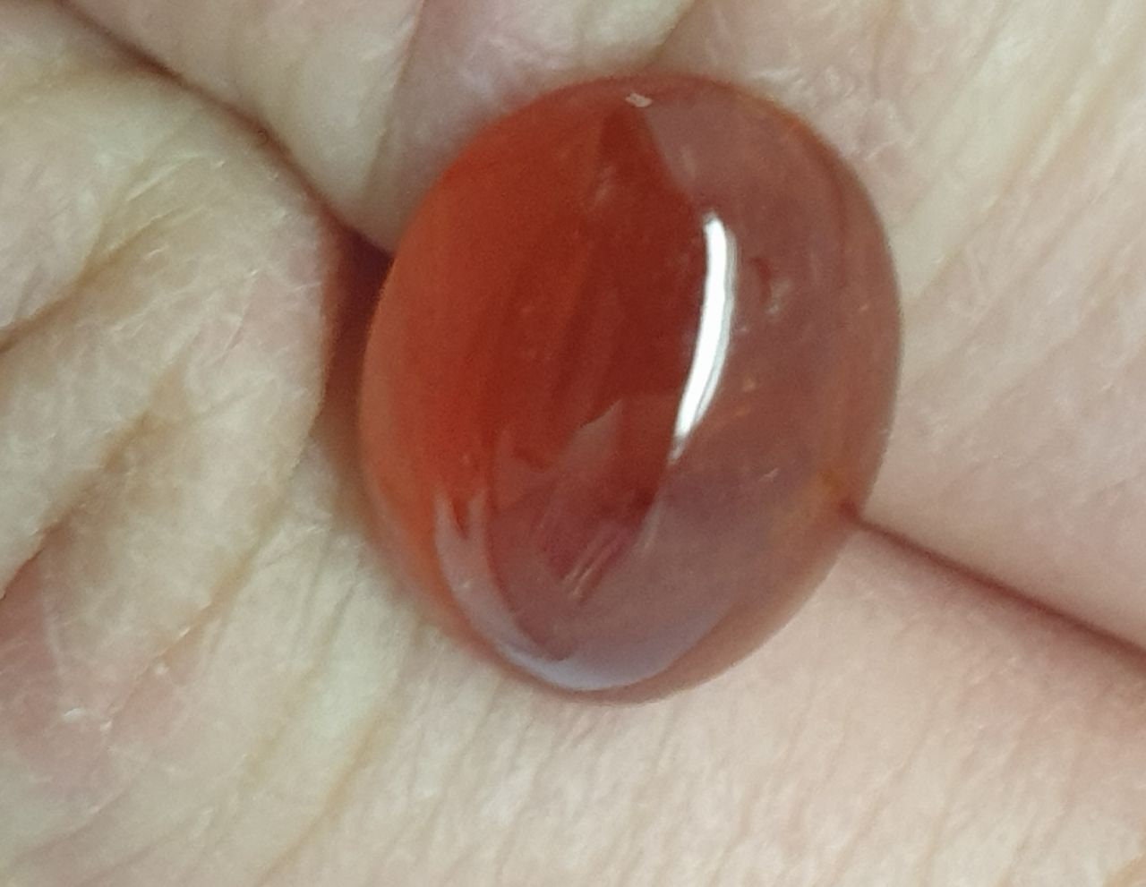 Spessartine Garnet Oval Cabochon 14x10.6mm. (10.7ct.).