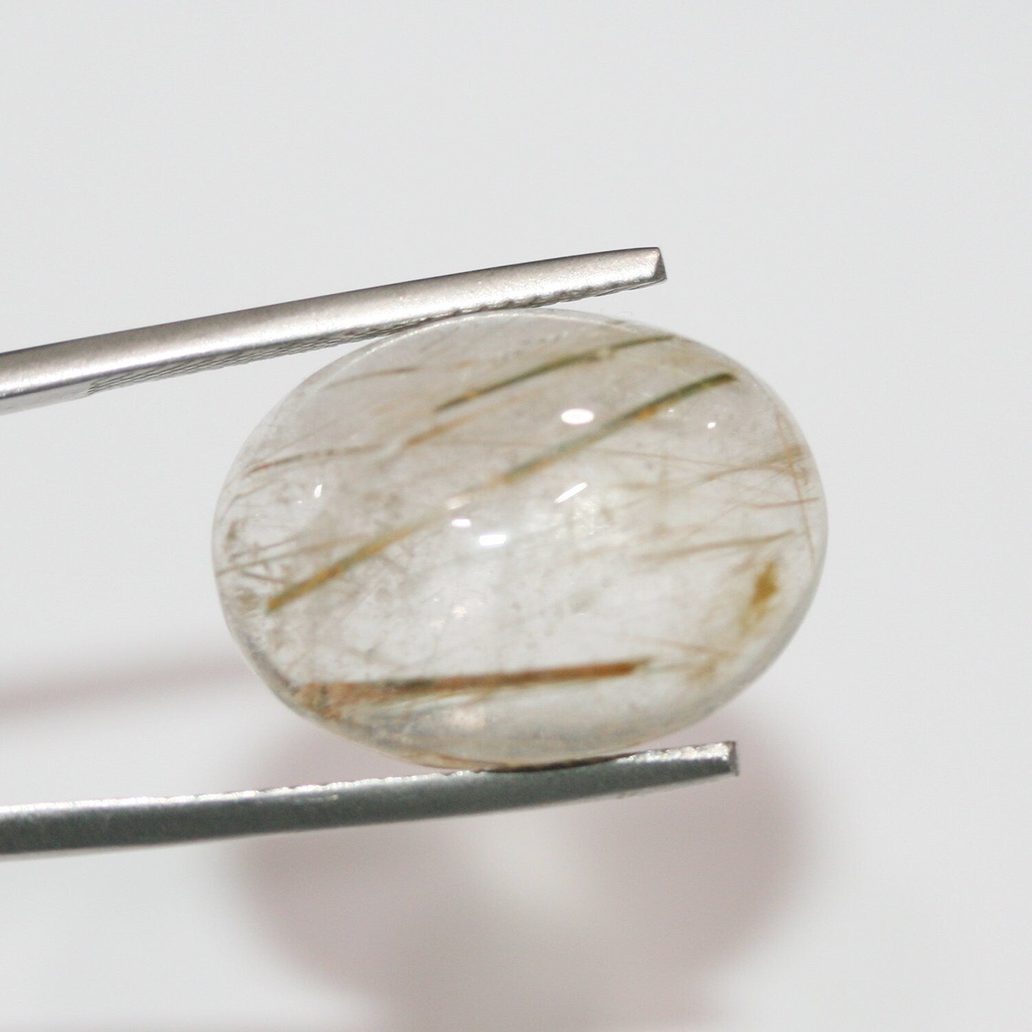 Lote de 2 cabujones ovalados de cuarzo rutilado de 20 x 15 mm. (2 uds.)