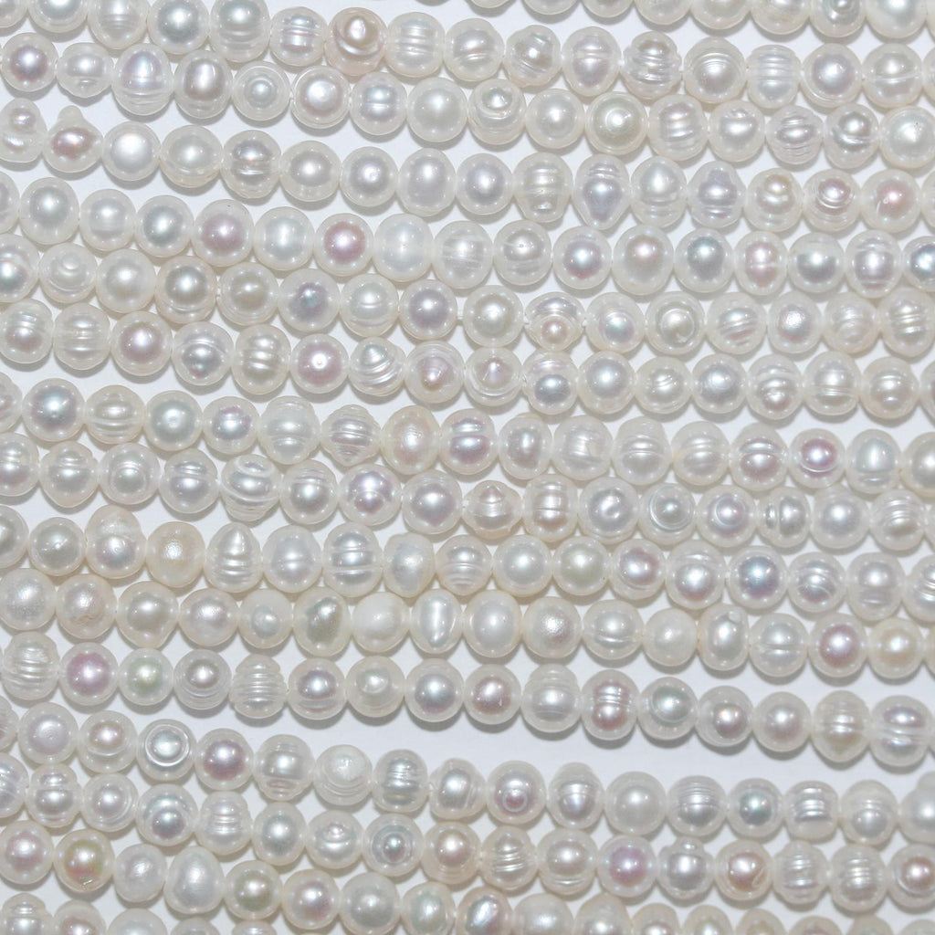 Perla de agua dulce redonda de 14" de St. 3,5-4 mm. - Hilo de 37 cm.