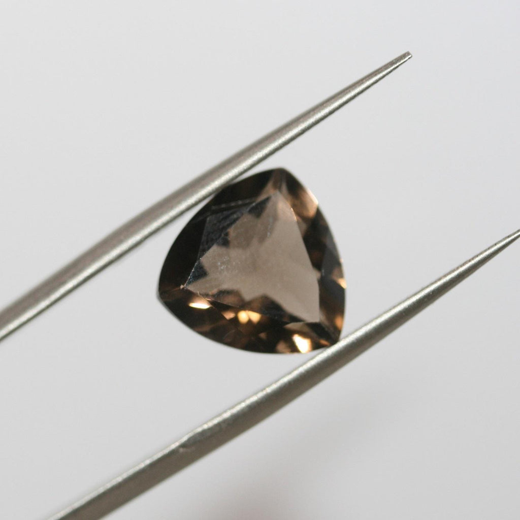 Lote de 4 trillones de cuarzo ahumado facetado de 12 mm.