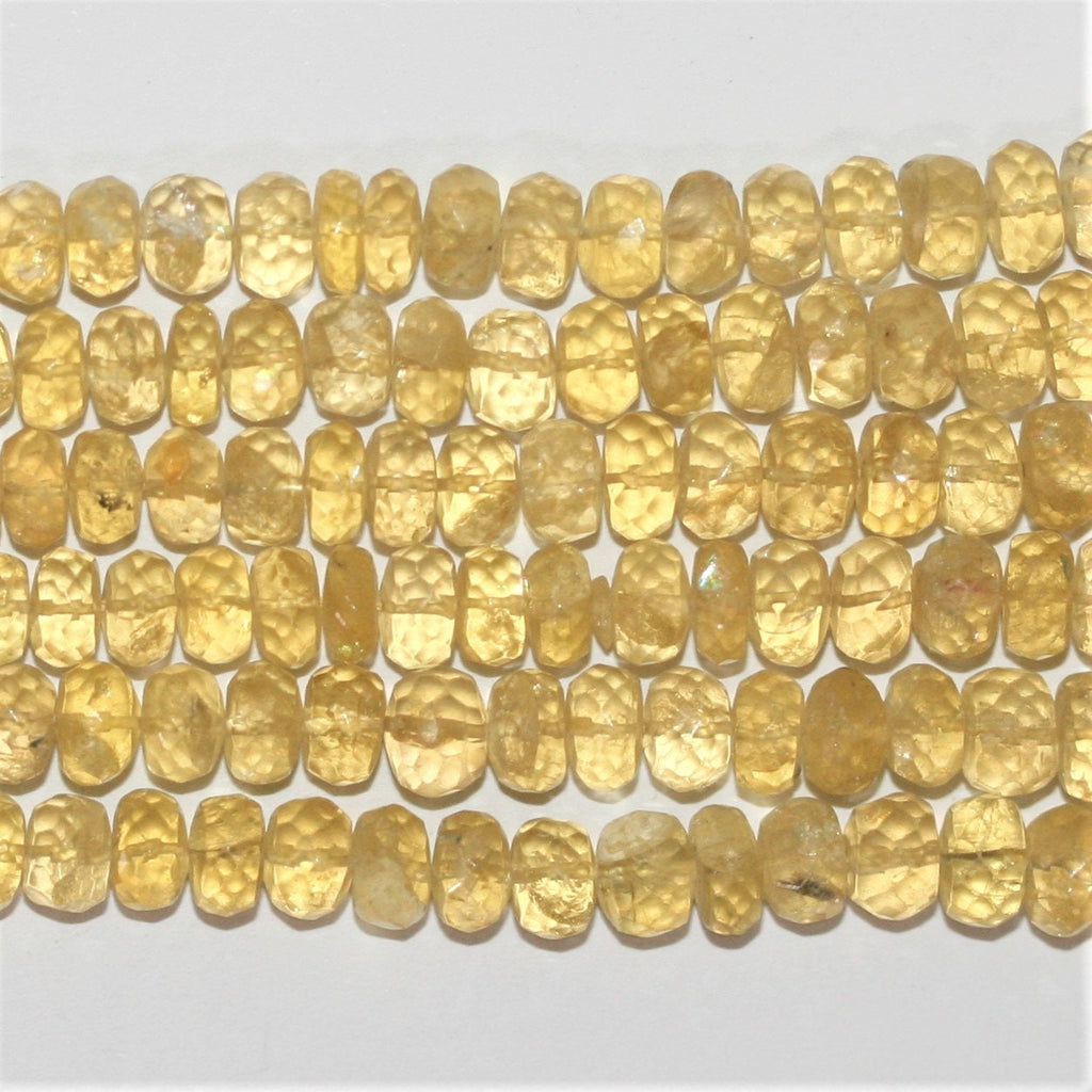 Perles rondelles graduées à facettes en béryl jaune 5x3-10x7mm. Longueur approximative du fil : 40 cm.
