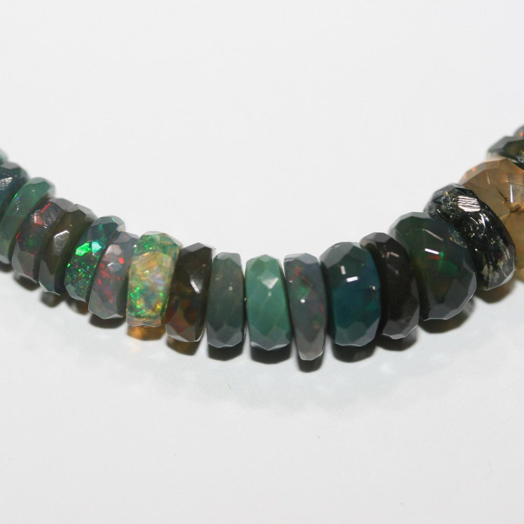 Cuentas redondas facetadas de ópalo etíope negro de 40 cm. 8,5 x 3 mm - 4 x 2 mm. Hilo de 40 cm.