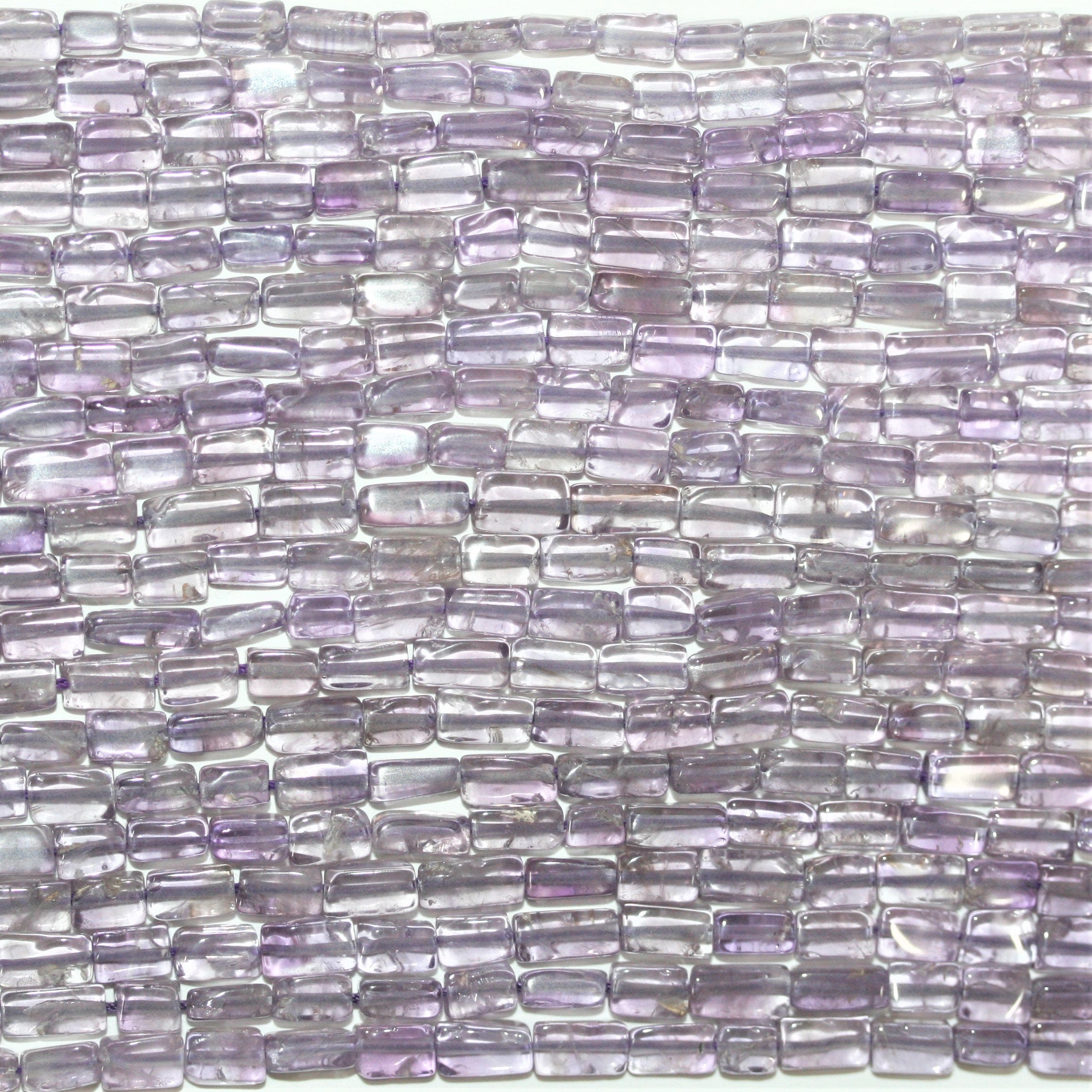 13" St Amethyst Smooth Prism Beads 6x3mm. Approx.- Strand 33cm.
