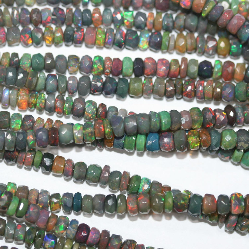 Cuentas redondas facetadas de ópalo etíope negro de 40 cm. 6,4 x 3,4 mm - 3,3 x 2,5 mm. Hilo de 40 cm.