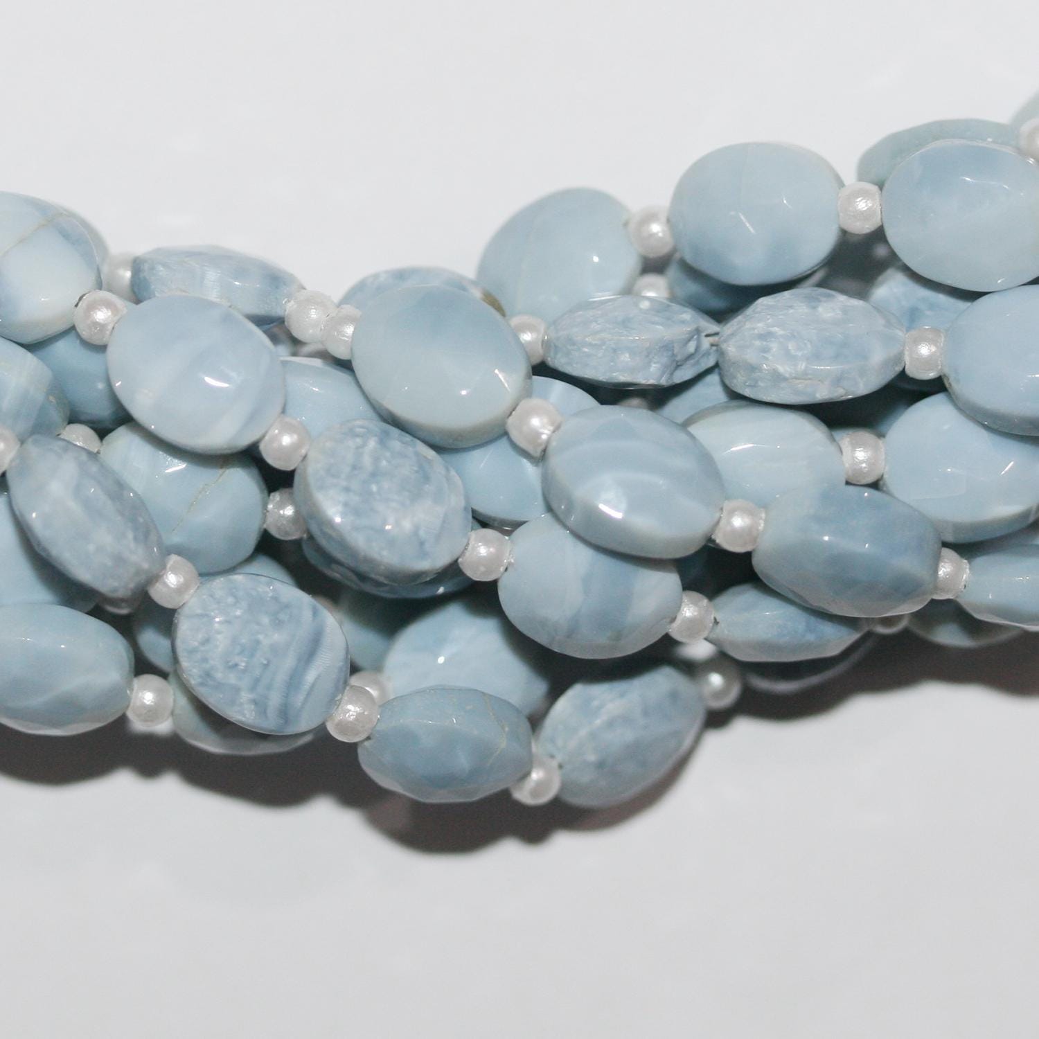 Cuentas ovaladas facetadas de ópalo azul de 16" de 9 x 7 mm - Hilo de 20 cm.