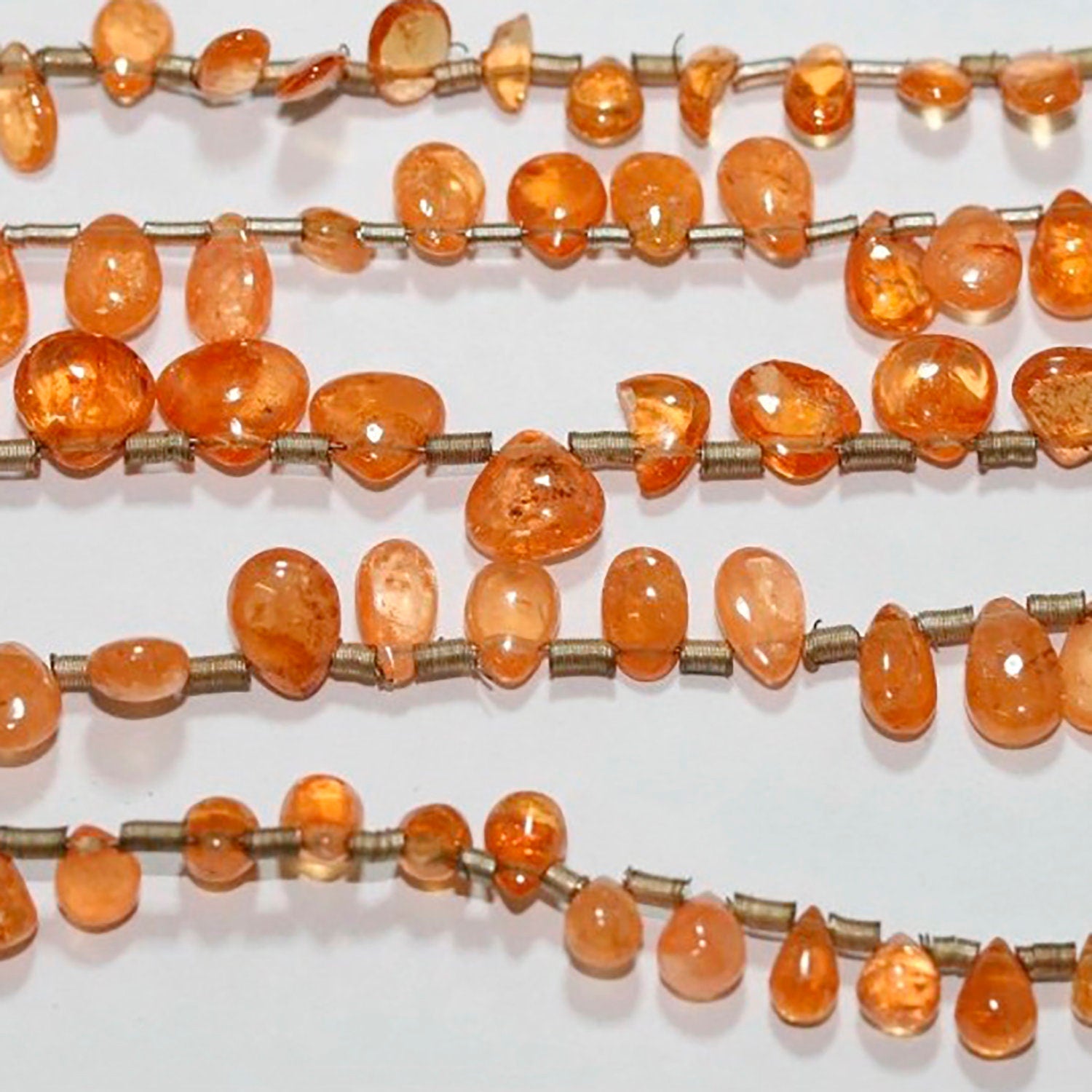 Cuentas lisas de granate Santa Espesartina de 7 x 4 mm (aprox.) - Hilo de 20 cm