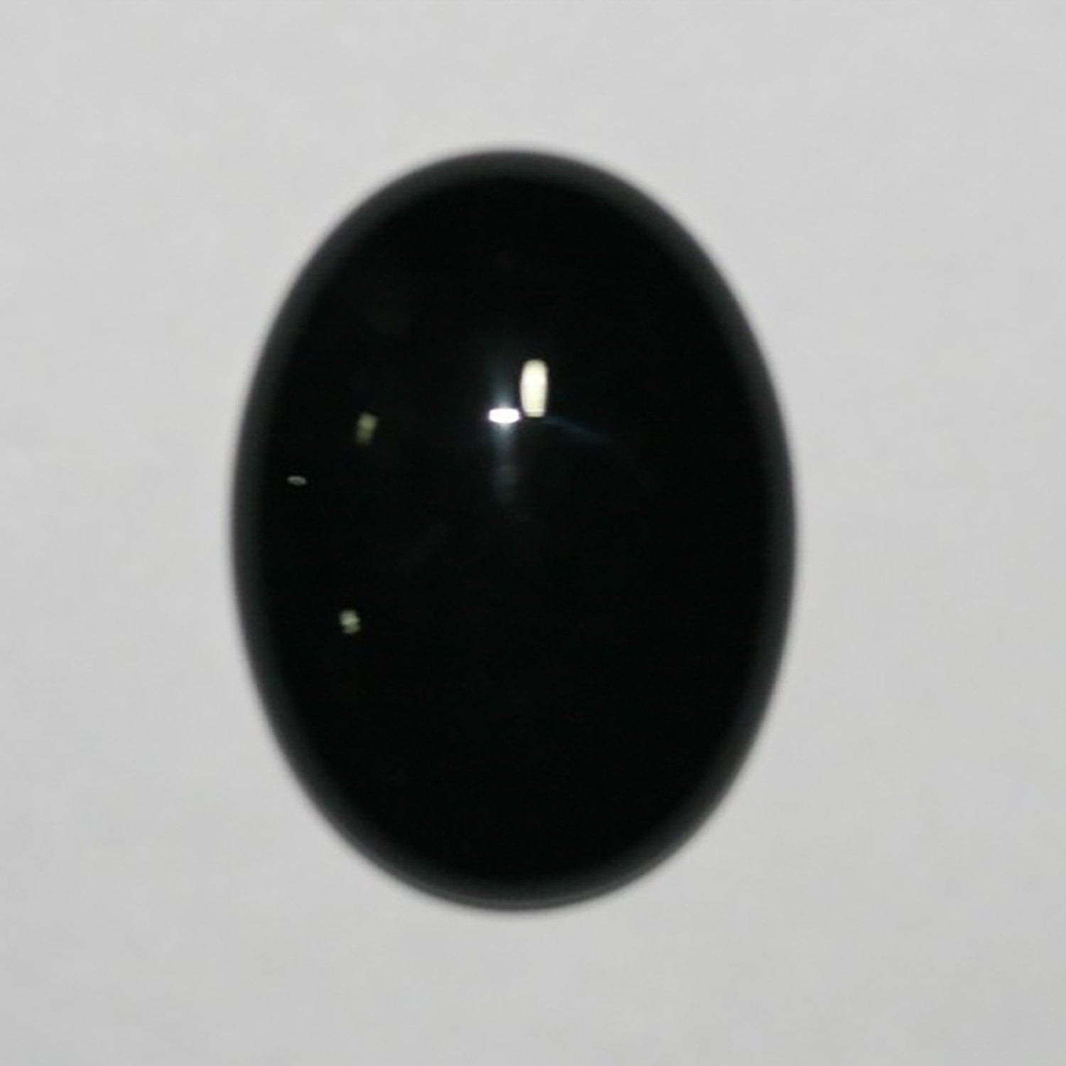 Lote de 2 cabujones ovalados de ónix de 25 x 18 mm. (2 uds.)