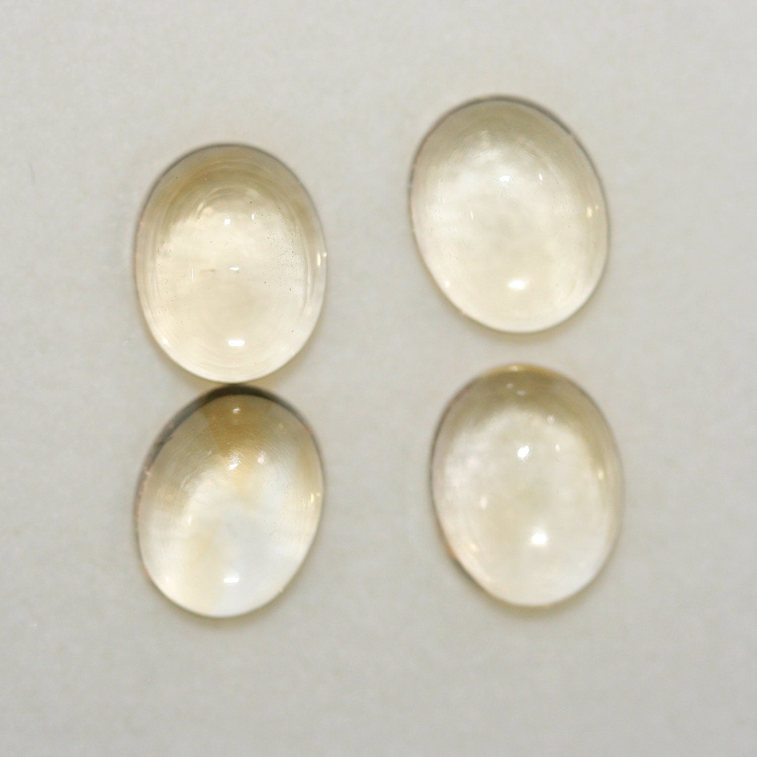 Lote de 4 cabujones ovalados de citrino de 10 x 8 mm. (4 piezas)
