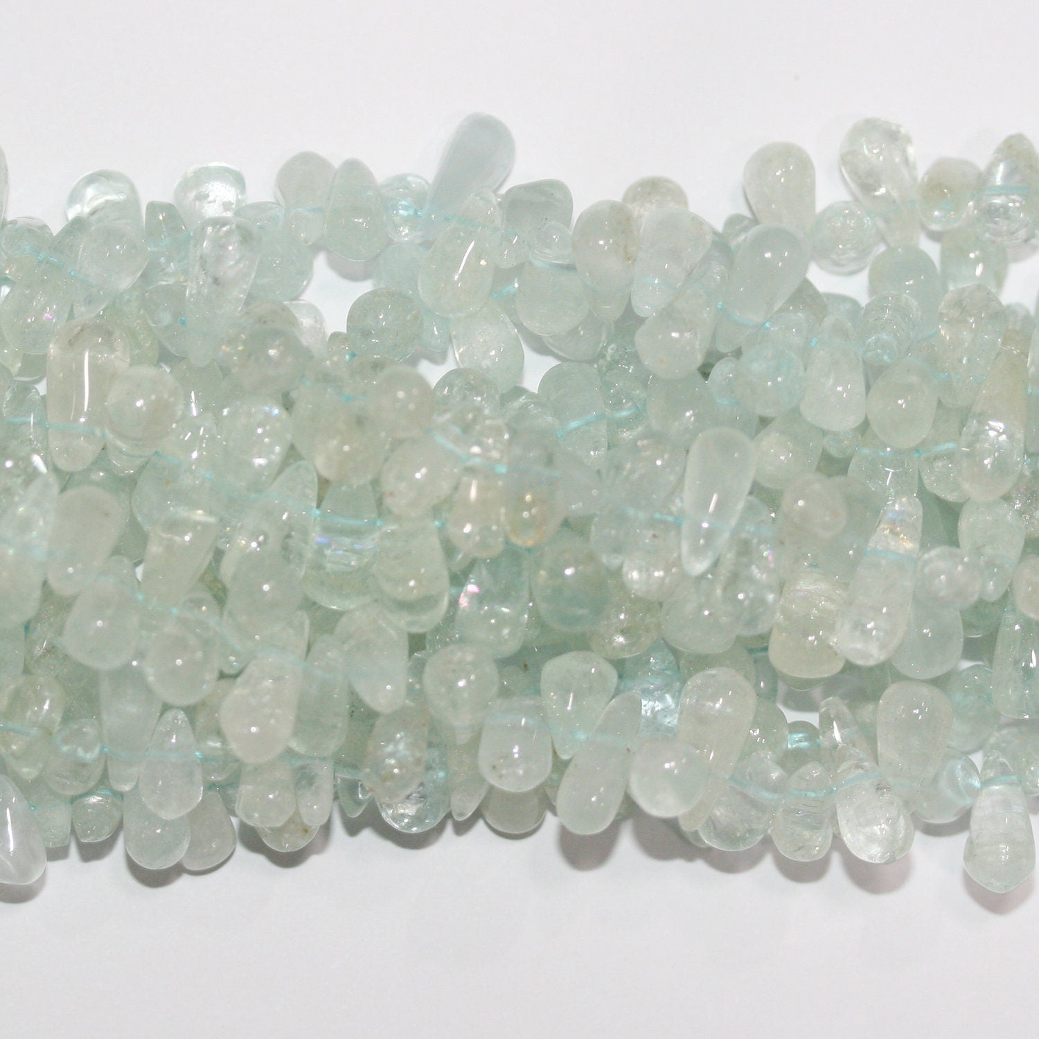 Cuentas lisas de aguamarina de 3" de largo, 8 x 5 mm. Aprox. - Hilo de 35 cm.