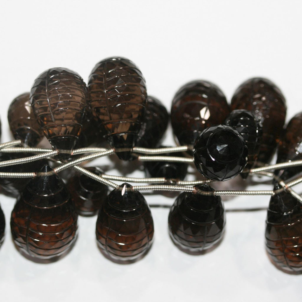 Cuentas de cuarzo ahumado talladas de 18 x 10 mm a 24 x 16 mm. Tira de 19 cm aprox. - Ref. 14890