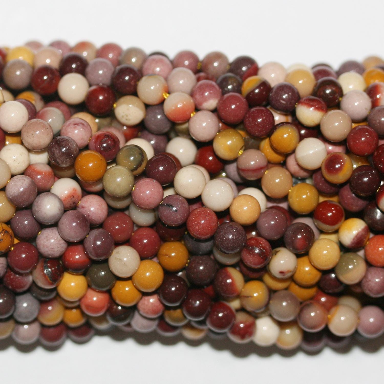 Cuentas redondas lisas de St. Mookaite de 16", 4-4,5 mm, tira de 40 cm.